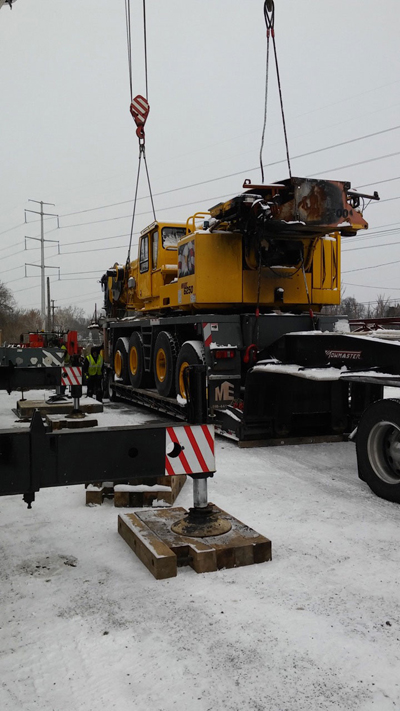 Export Logistics & Shipping, Inc. delivers Grove GMK6250 crane by flat rack using jib hooks